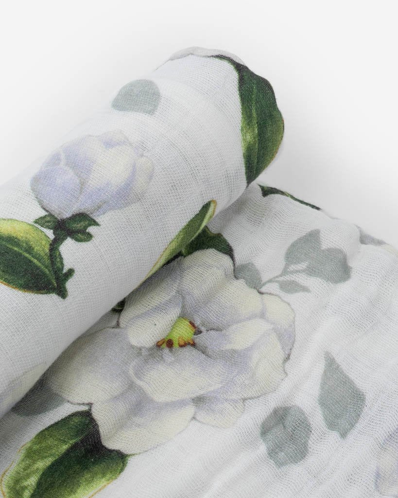 little unicorn cotton muslin swaddle in magnolia blooms