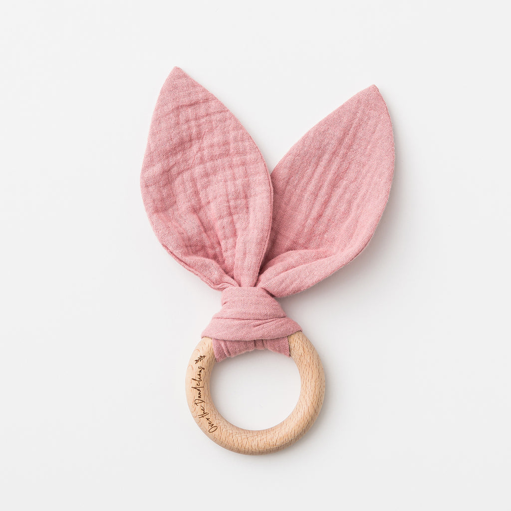 over the dandelions bunny ears teether in shell pink