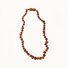 nature baby amber beads in cognac