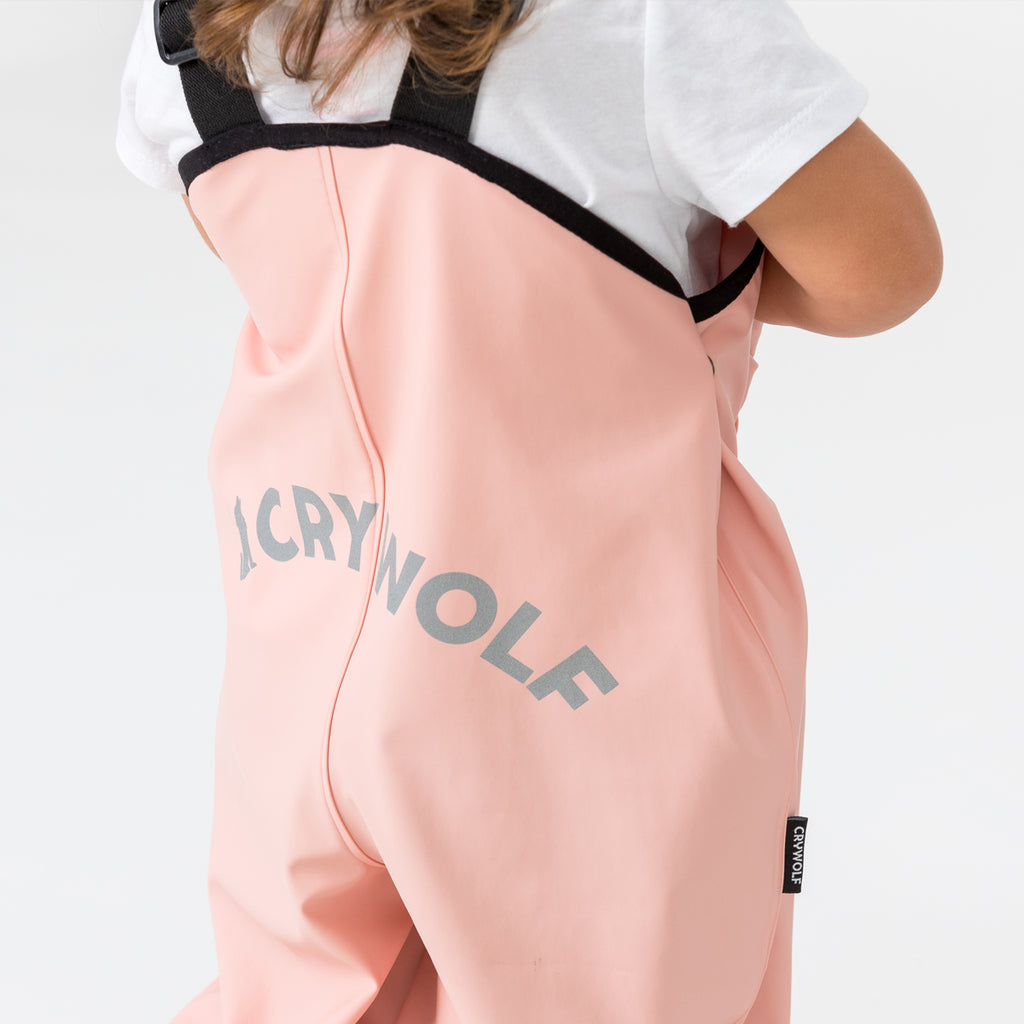 cry wolf rain overalls in blush pink