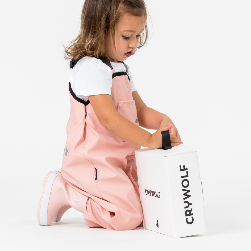 cry wolf rain overalls in blush pink