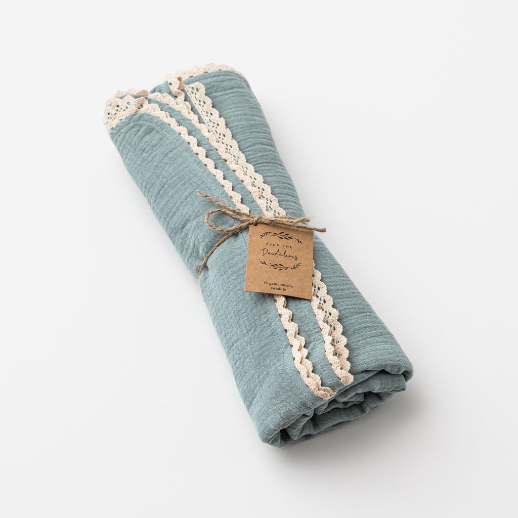 over the dandelions muslin swaddle with lace in sage