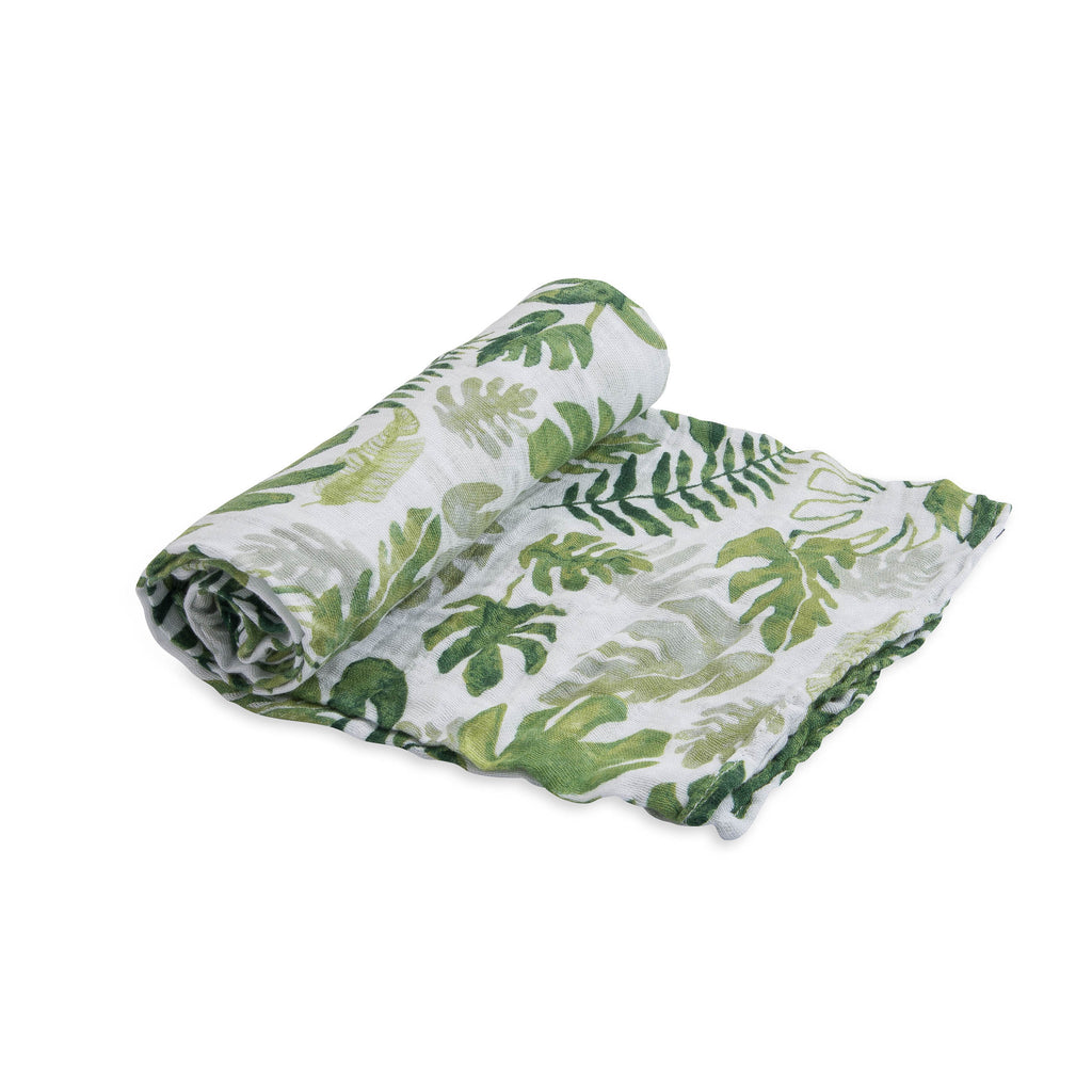 little unicorn cotton muslin swaddle in tropical leaf