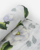 little unicorn cotton muslin swaddle in magnolia blooms
