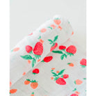 little unicorn cotton muslin swaddle in strawberry