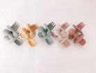 petite eats silicone cutlery set in sand